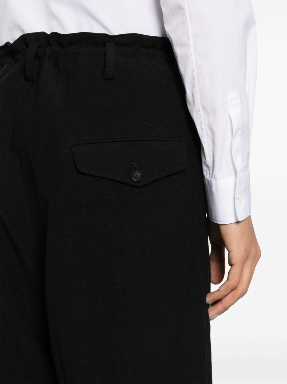 Shop Yohji Yamamoto Tapered-leg Trousers In Black