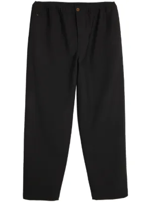 アンダーカバー スリムフィットパンツ アンダーカバー グラフィックプリントジョガーパンツ ブラック