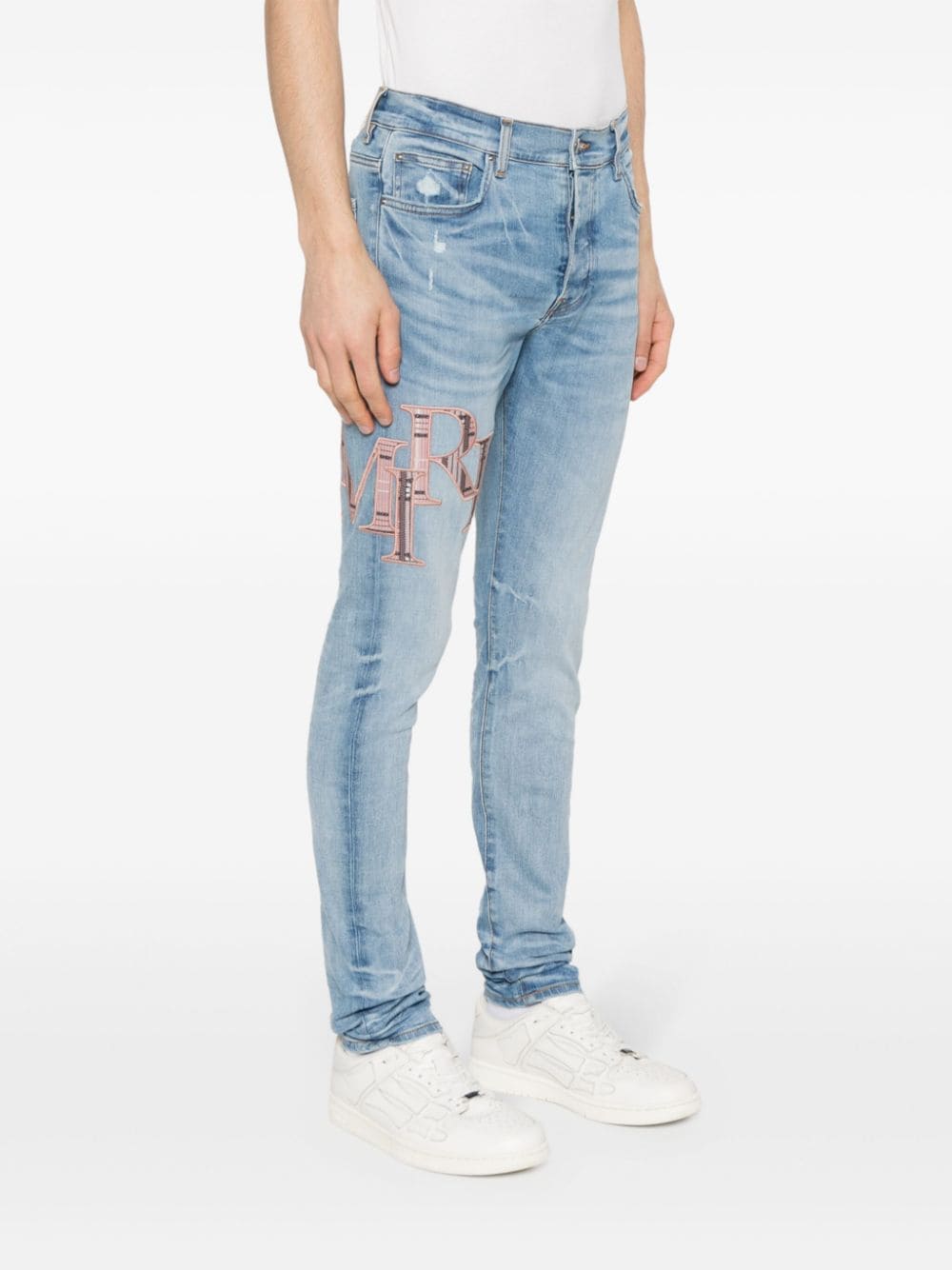 Shop Amiri Logo-embroidered Skinny Jeans In Blue