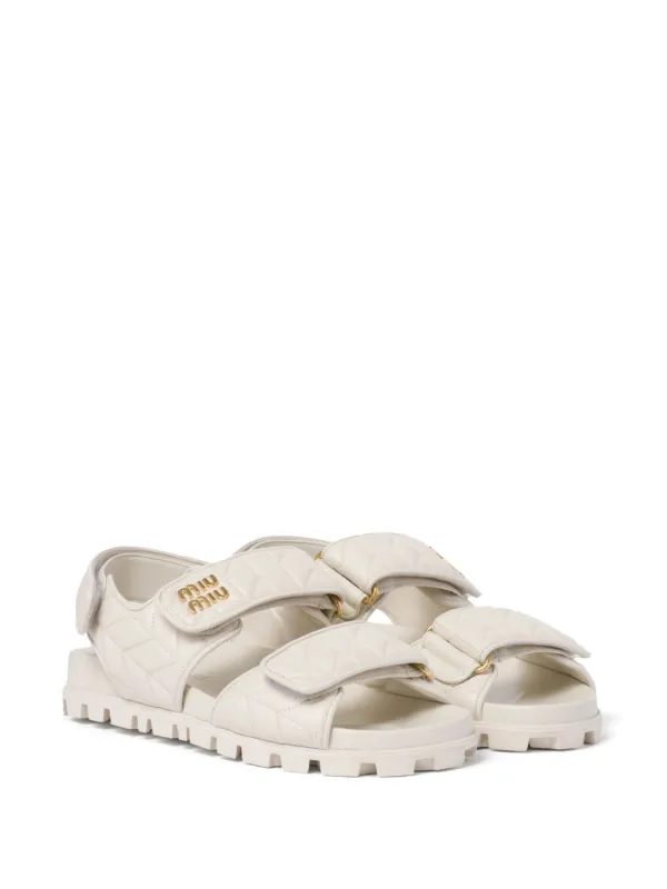 MiuMiu Matelass Leather Mules マトラッセ ミュール ロゴ Miu Miu Matelassé logo-plaque Sandals | Neutrals | FARFETCH