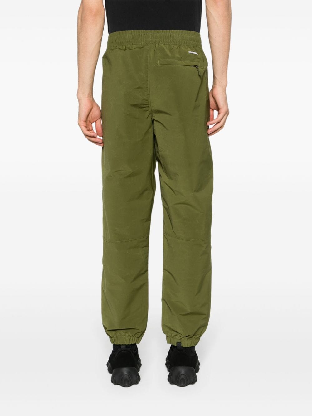 Shop The North Face Easy Wind Tapered Trousers In Green