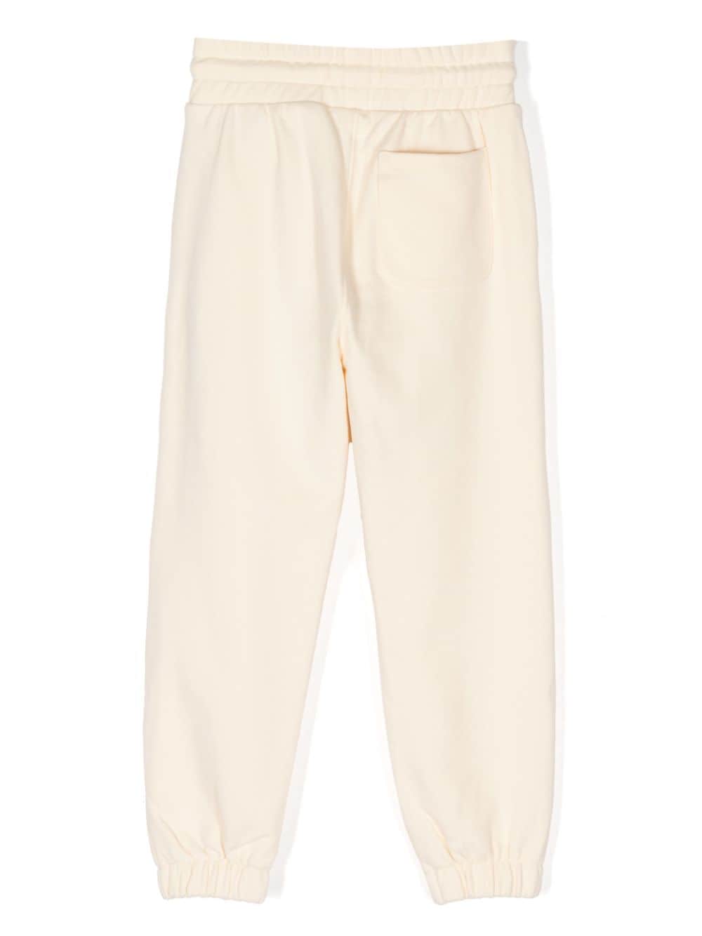 Shop Calvin Klein Logo-embroidered Pleated Track Pants In Yellow