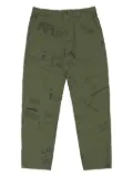 Engineered Garments Fatigue graffiti-print trousers - Green