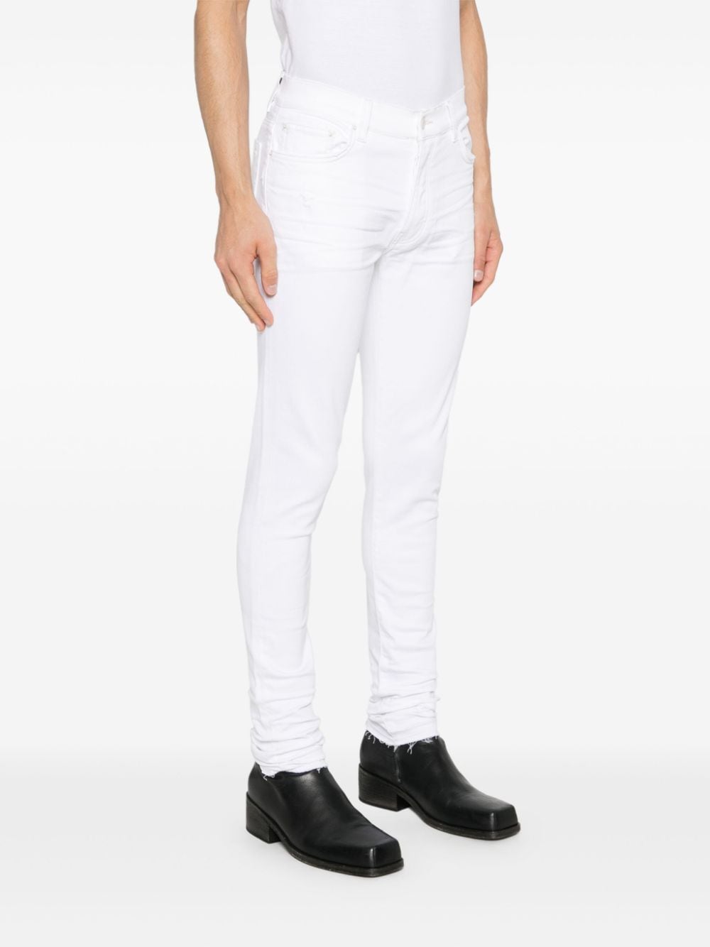 Shop Amiri Released Hem Skinny Jeans In White