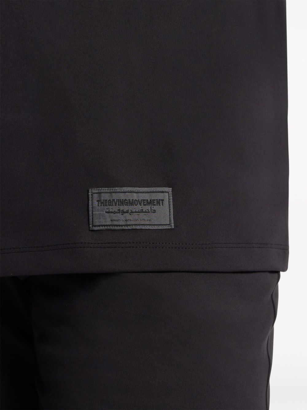Shop The Giving Movement Logo-appliqué T-shirt In Black