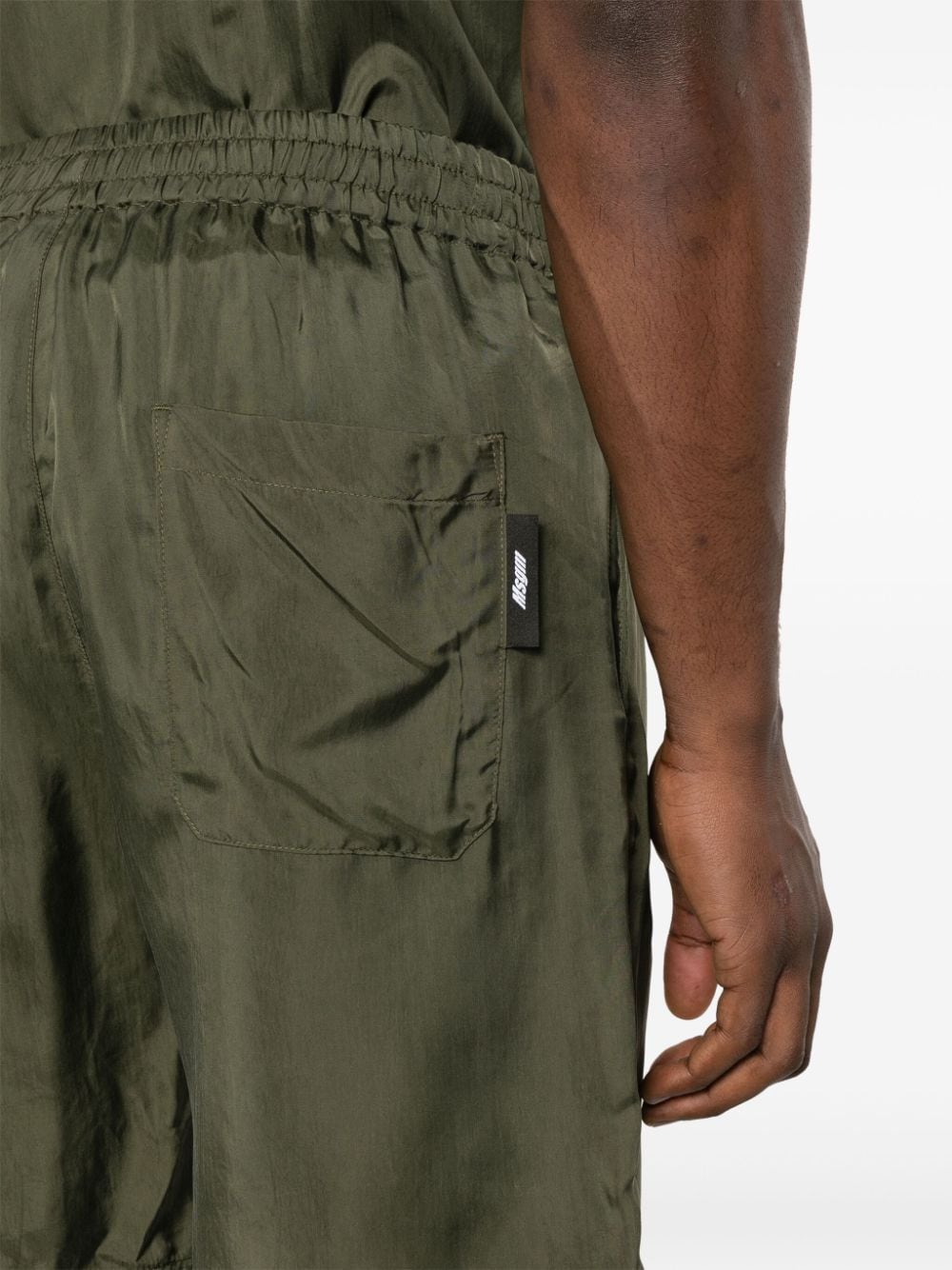 Shop Msgm Embroidered-logo Track Shorts In Green