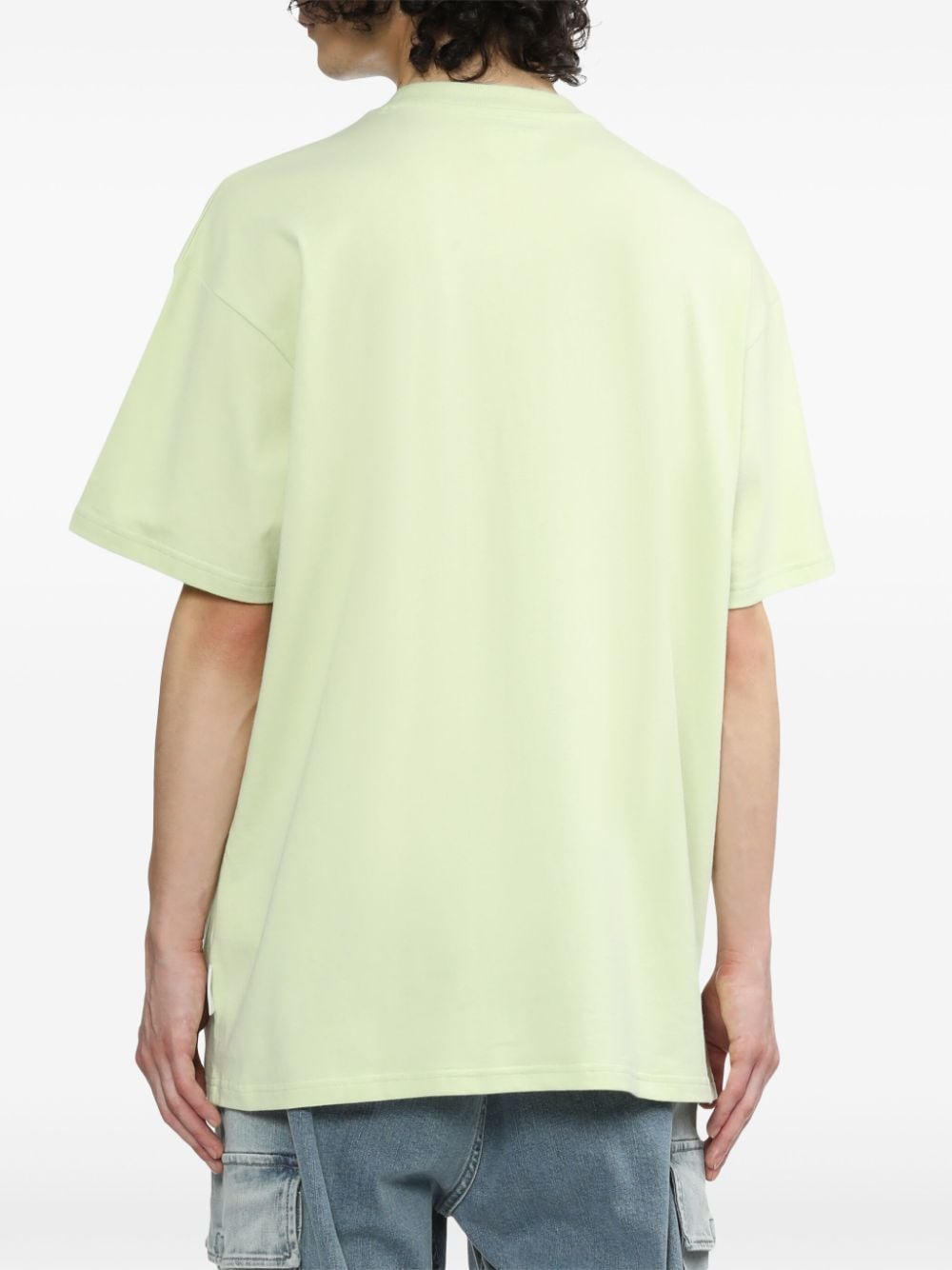 Shop Izzue Debossed-slogan Cotton T-shirt In Green