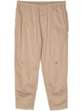 Undercover elastic-waist tapered trousers - Neutrals