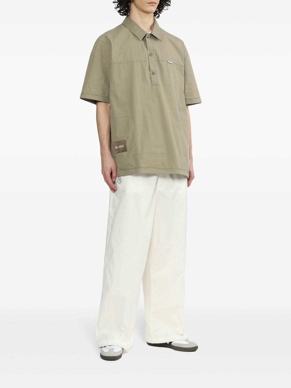 Shop Izzue Logo-appliqué Loose-fit Trousers In White