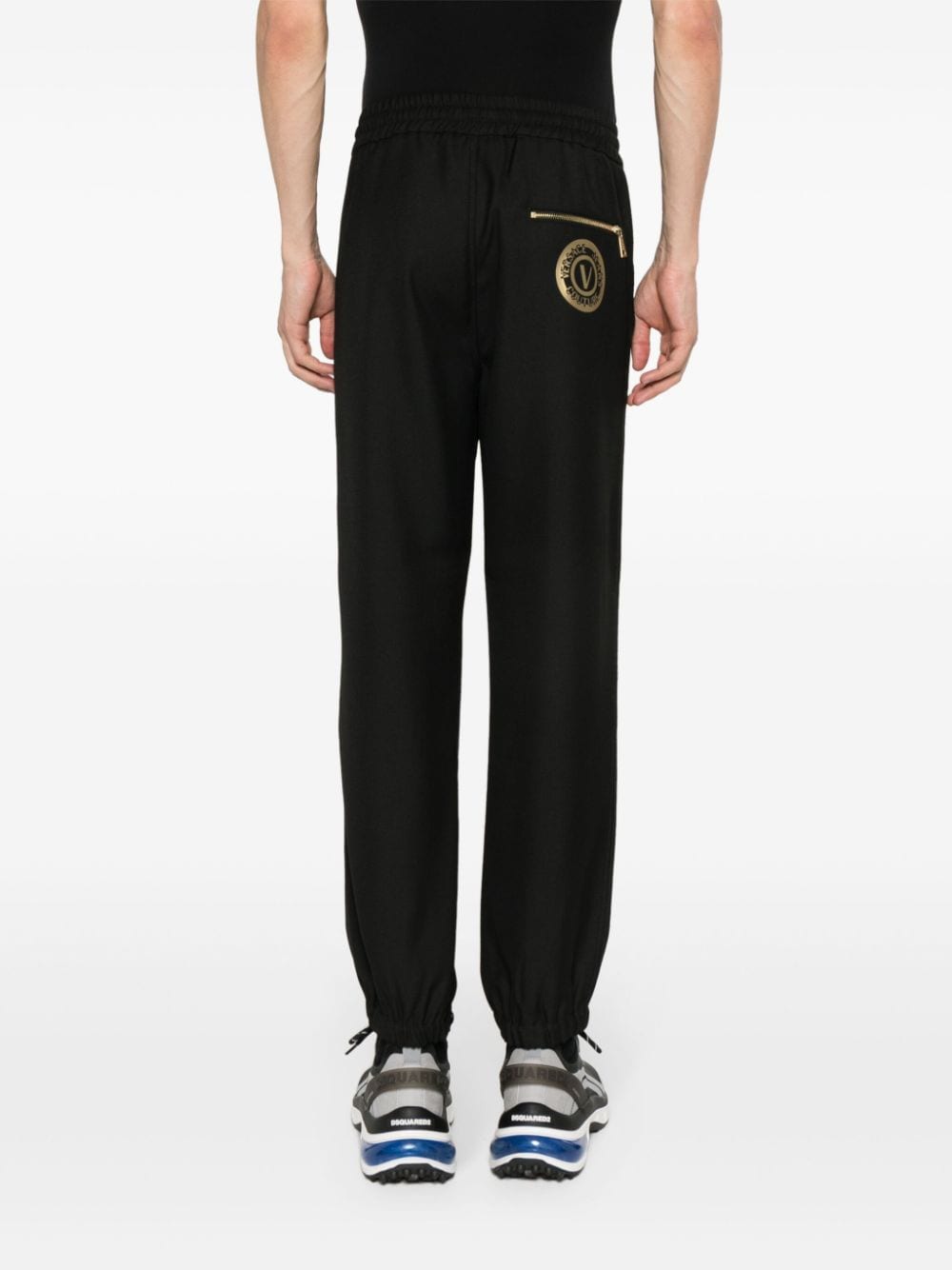 Shop Versace Jeans Couture V-emblem Tapered Trousers In Black