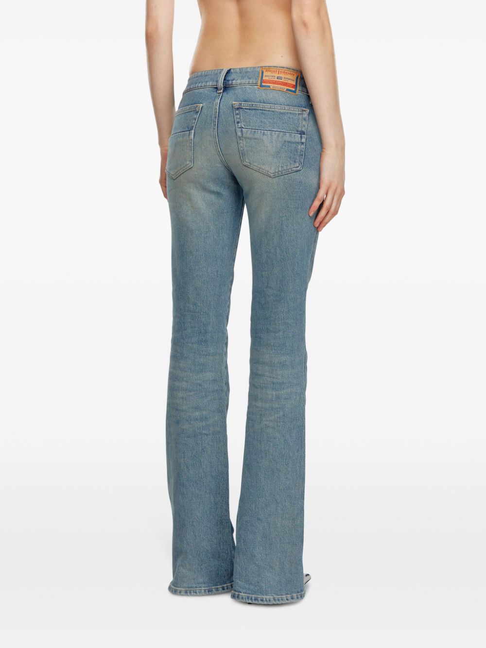 Shop Diesel D-hush Low-rise Bootcut Jeans In Blue