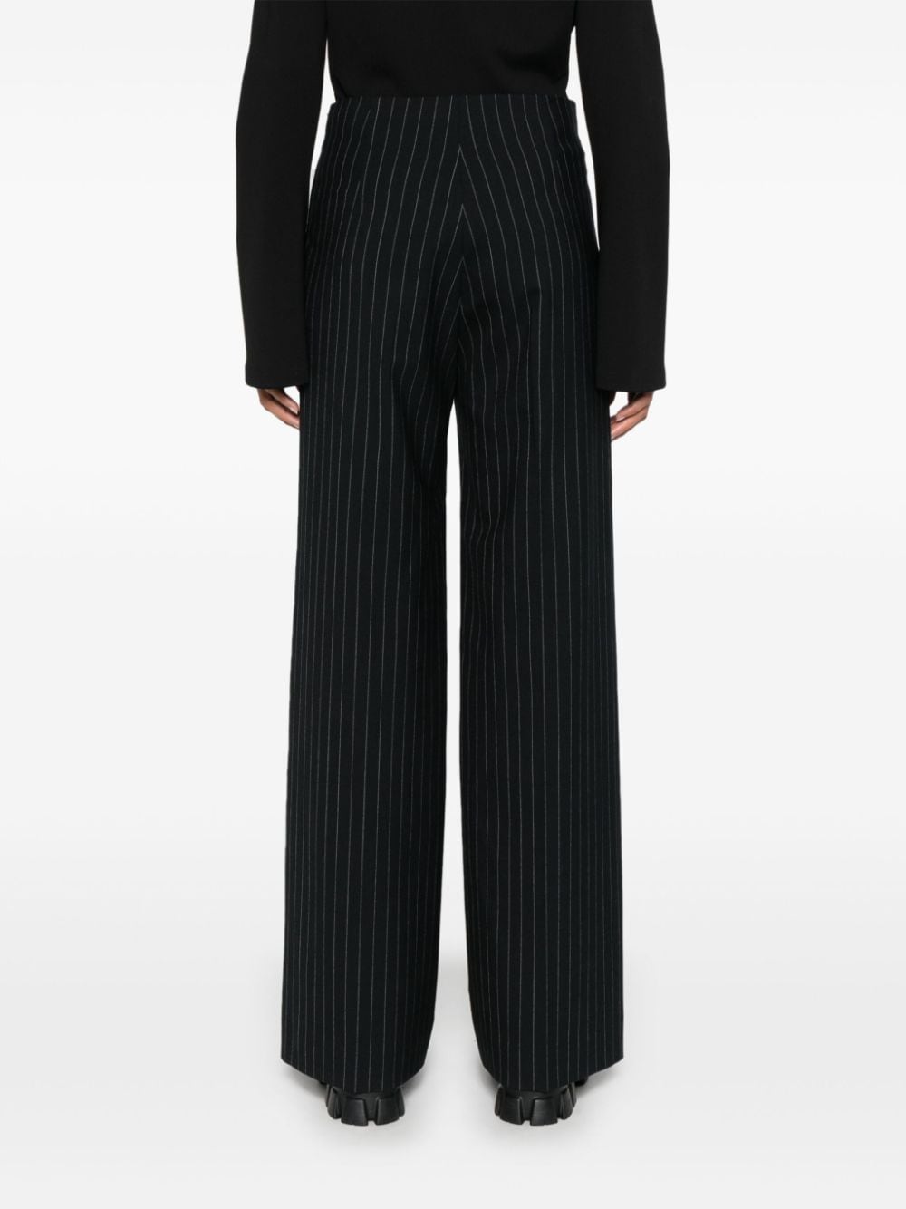 Shop Sandro Pinstripe Trousers In Black