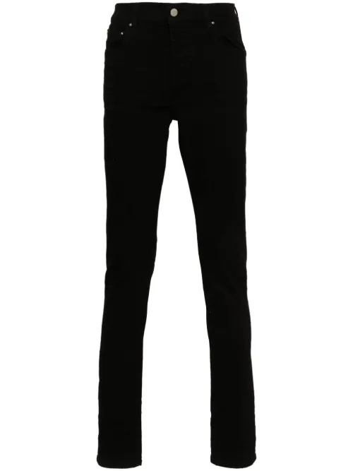 Jean Stack à coupe skinny - AMIRI - Modalova