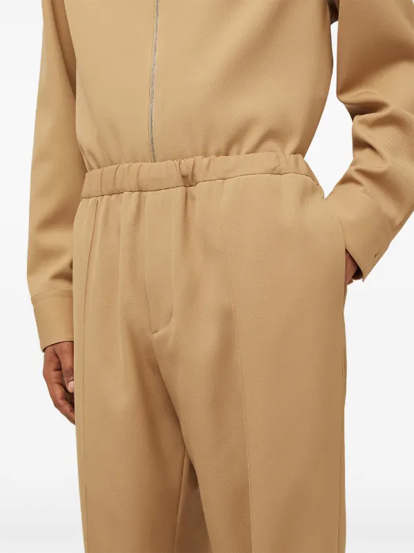 Jil Sander elasticated-waist Tapered Trousers | Brown | FARFETCH