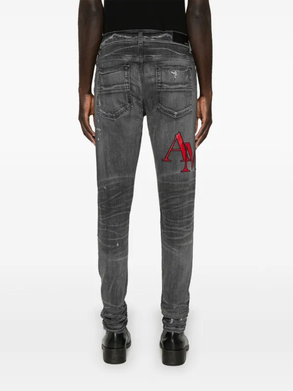 AMIRI ブラック ダメージスキニージーンズ AMIRI ダメージ スキニージーンズ | ブラック | FARFETCH JP