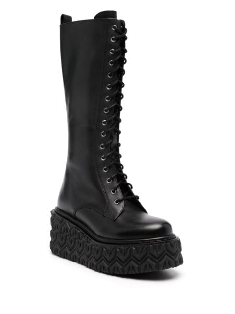 Fly-embossed wedge boots