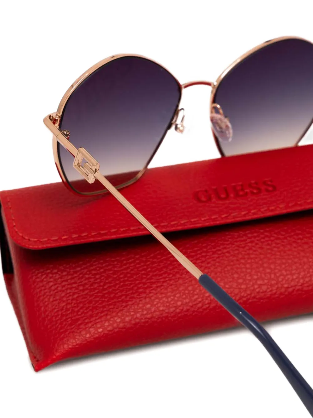 GUESS EYEWEAR Zonnebril met geometrisch montuur en logo Goud