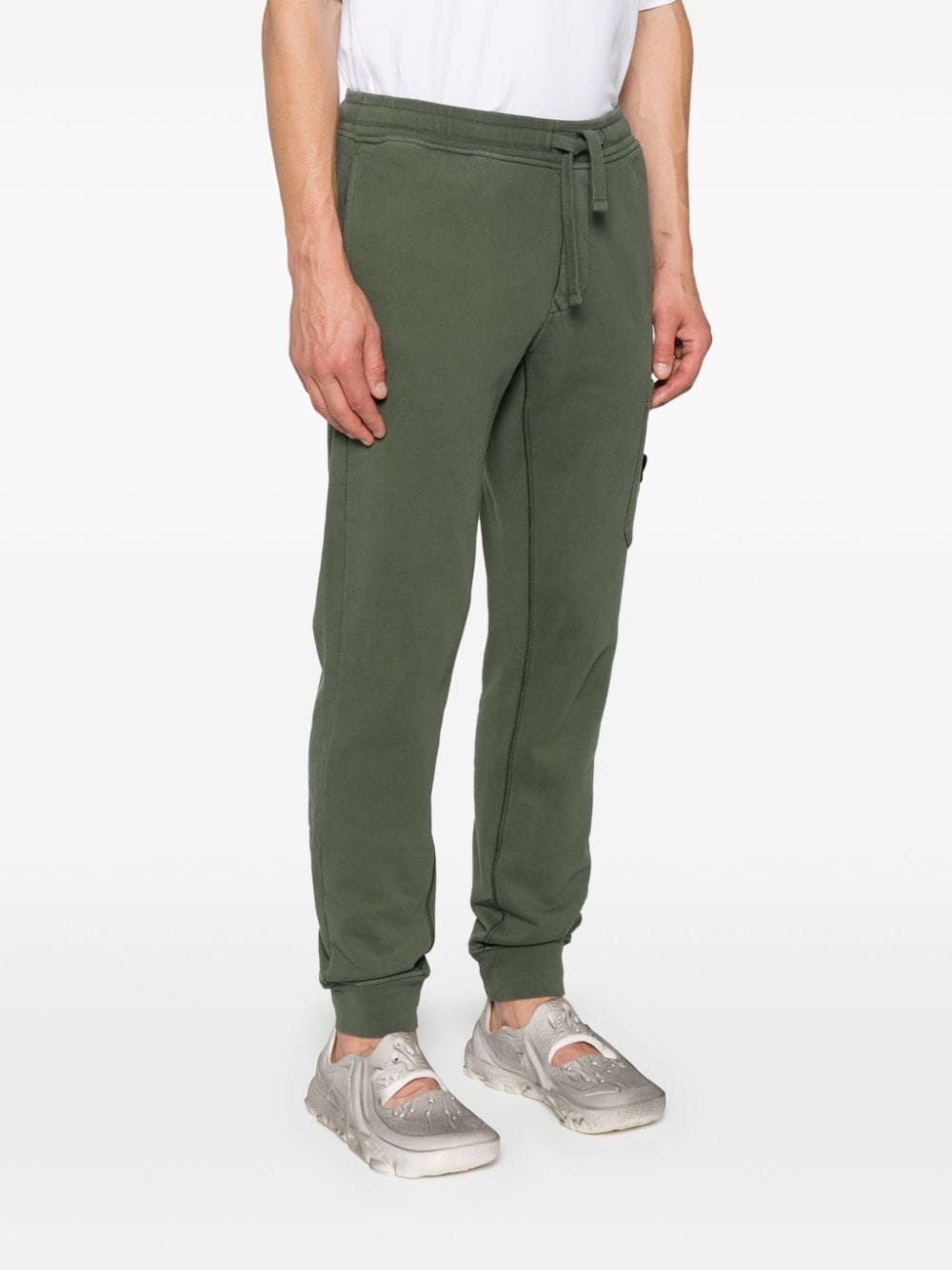 Shop Stone Island Compass-badge Tapered Trousers In Green