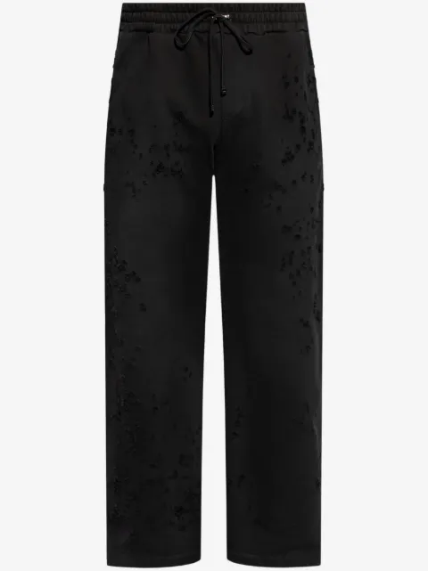 AMIRI pants con efecto envejecido