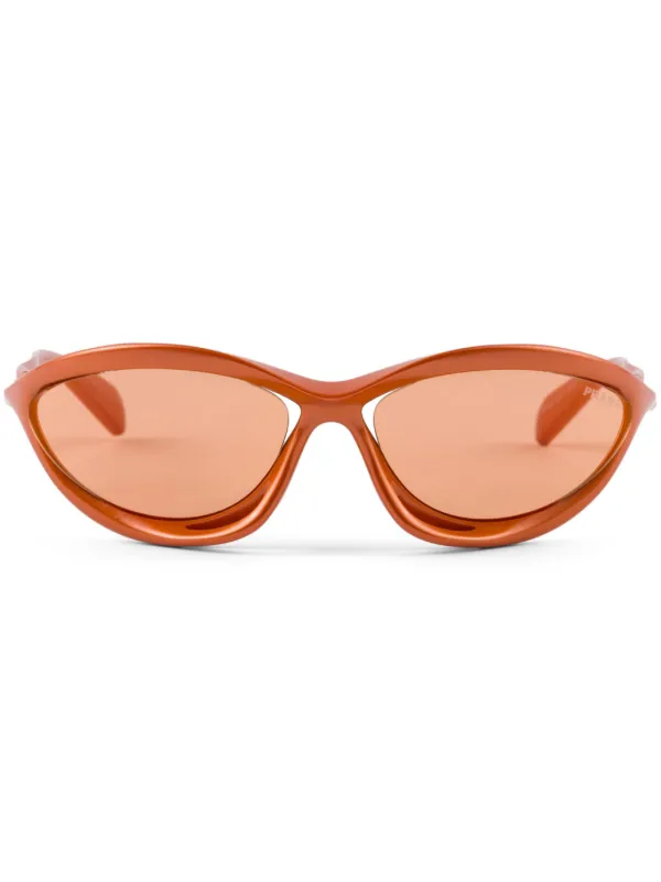 Prada Eyewear sculpted shield frame sunglasses women Bio Nylon One Size Orange