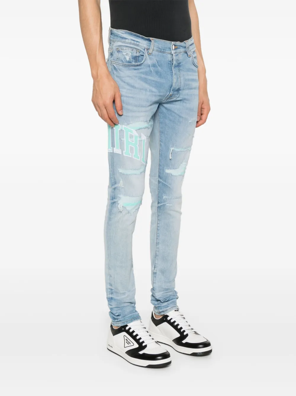 AMIRI VARSITY LOGO SKINNY JEANS