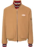 Moschino logo-appliqué twill bomber jacket - Brown