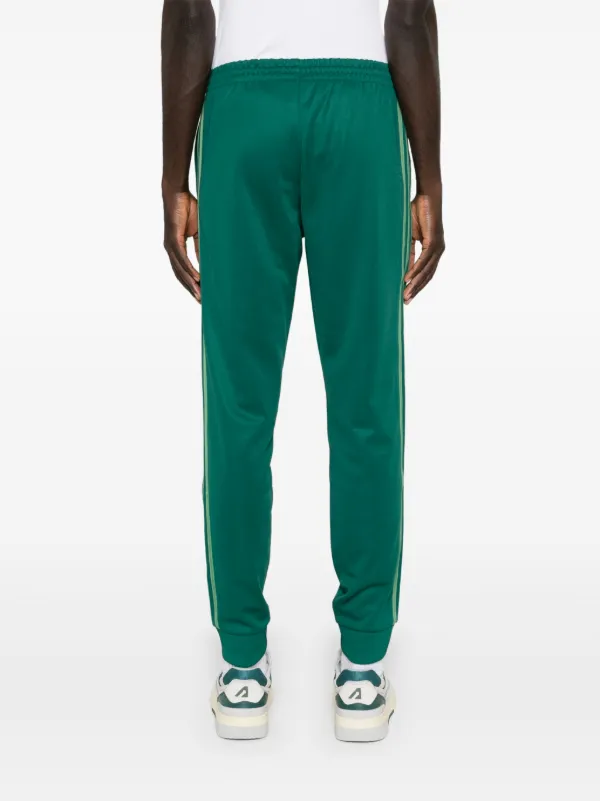 Adidas sst track pants green best sale