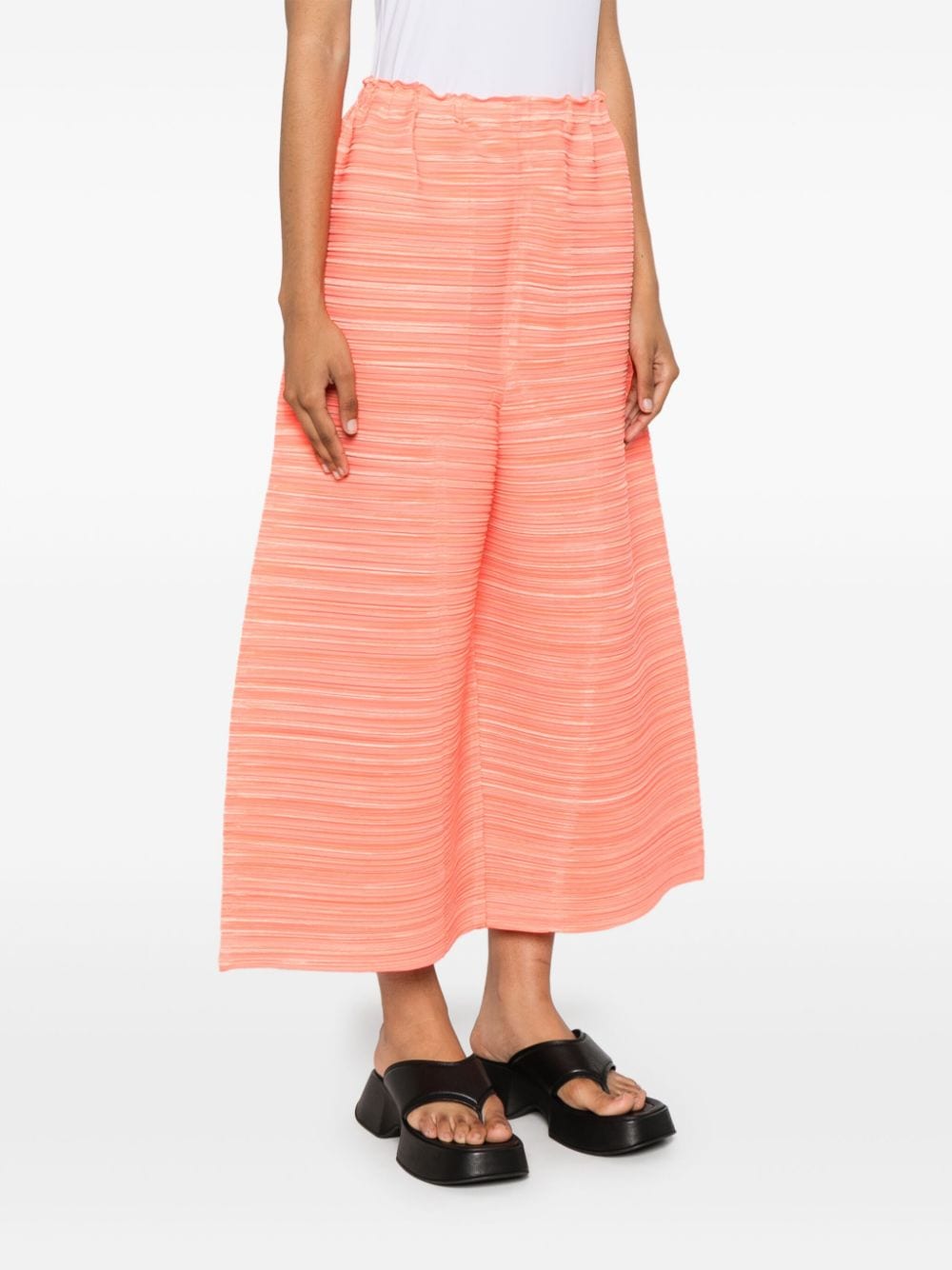 Shop Issey Miyake Sheer Bounce Cropped Trousers In 橘色