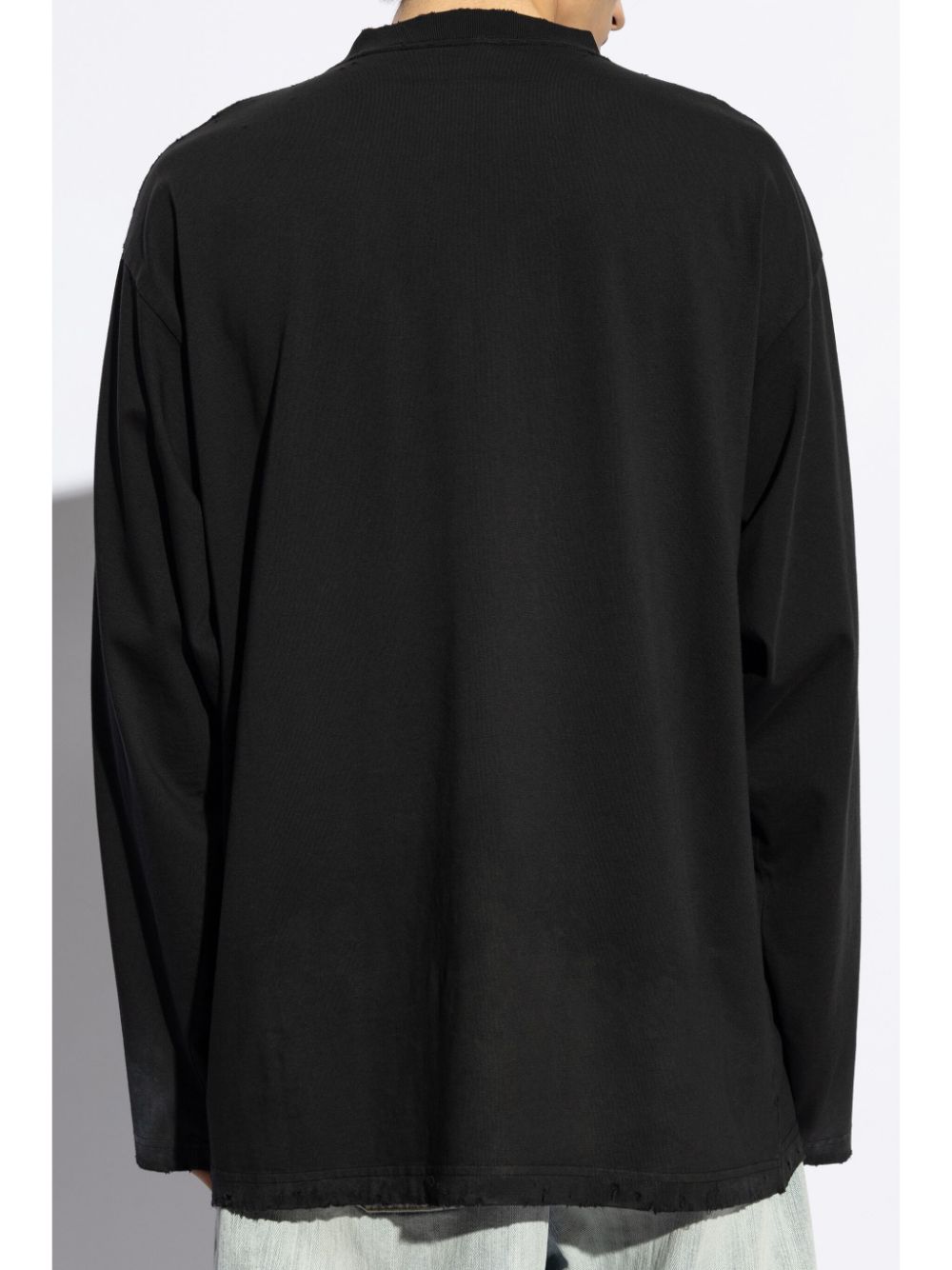 Shop Balenciaga Distressed Logo-print Jumper In Black