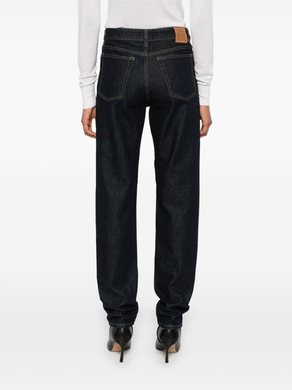 Shop Totême Low Tapered Jeans In Blue