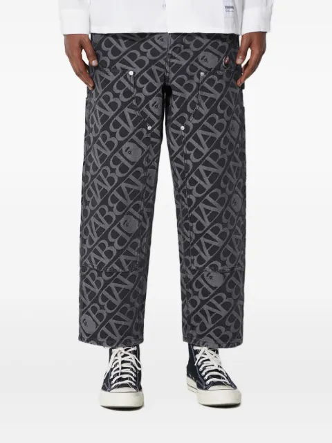 A BATHING APE® logo-pattern carpenter jeans