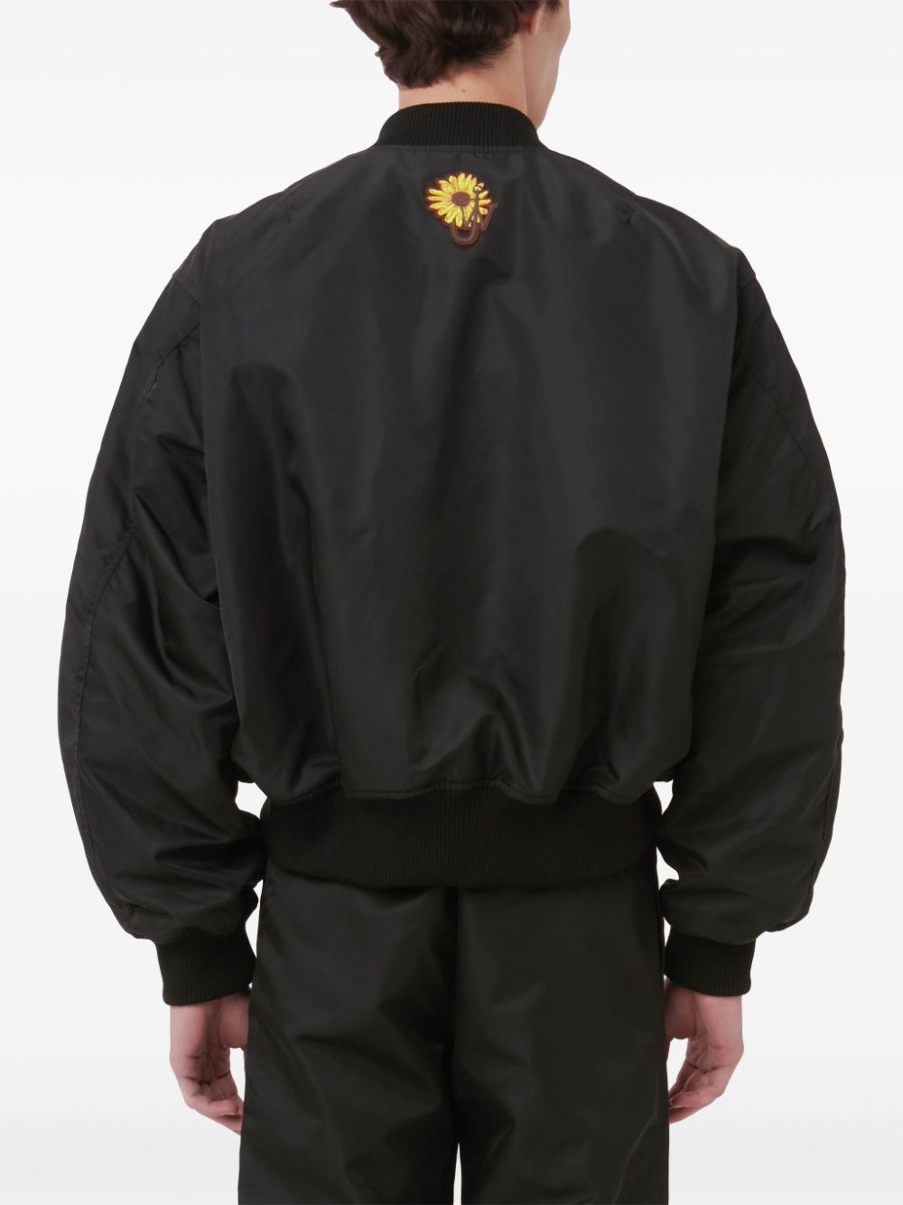 Shop Jw Anderson Curved-hem Bomber Jacket In Black