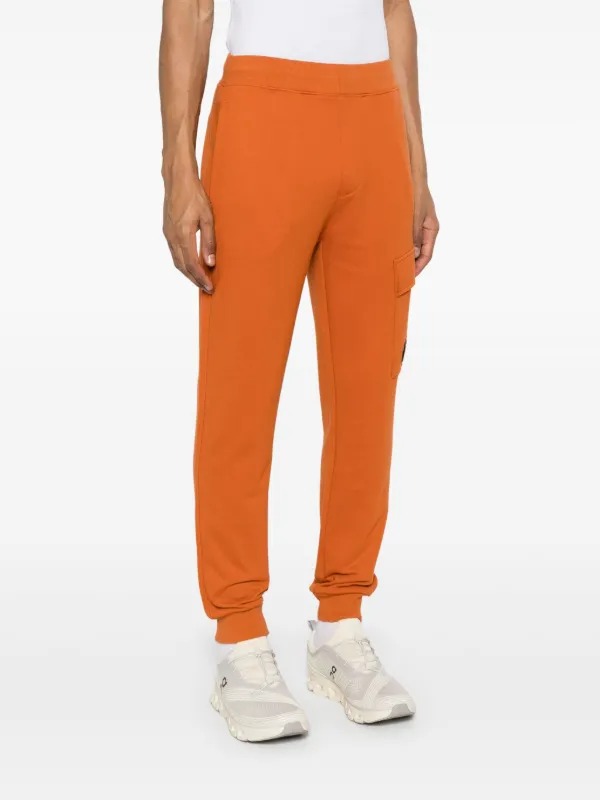 C.P. Company フリース トラックパンツ | オレンジ | FARFETCH JP