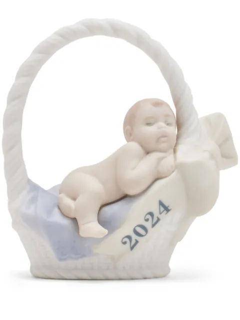 Lladró baby in a basket porcelain sculpture