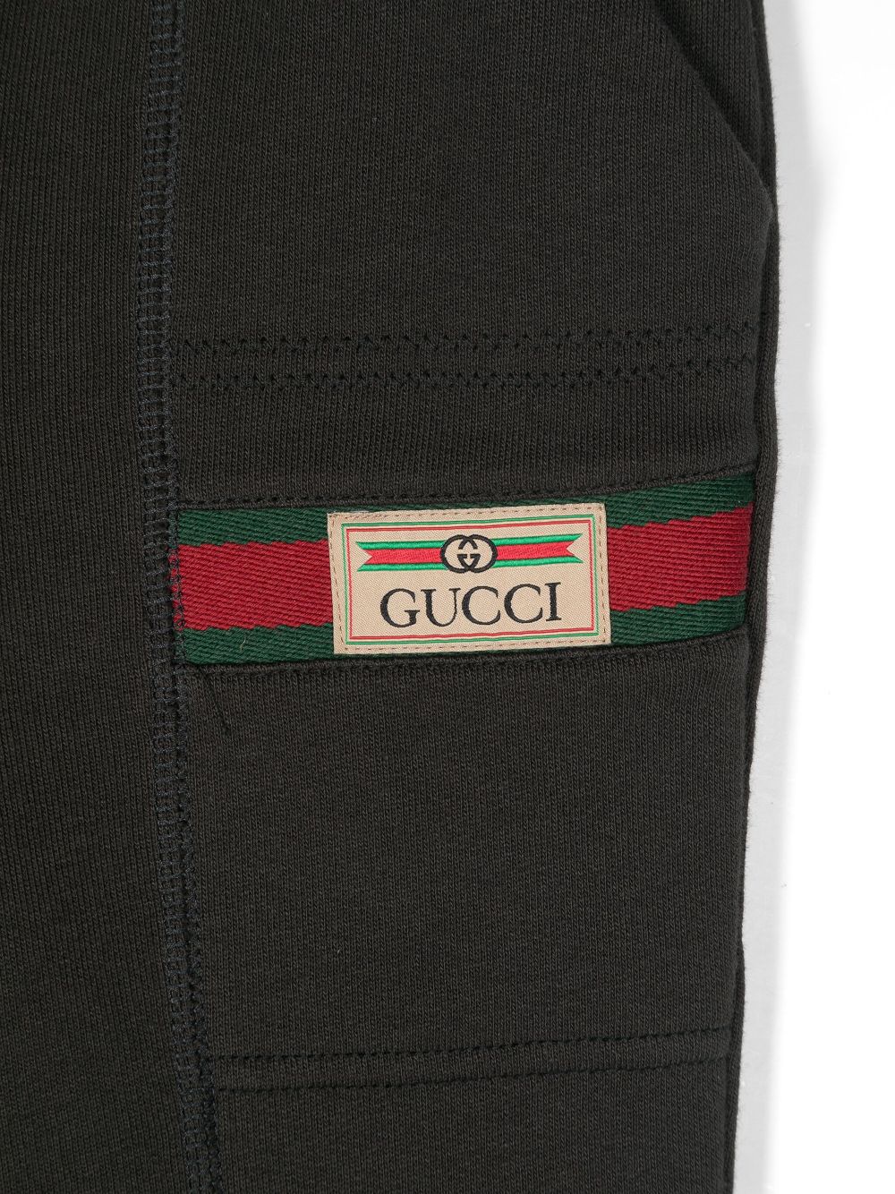 Shop Gucci -label Track Pants In Grey