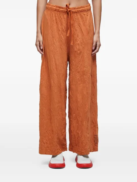Osklen wrinkle-effect trousers
