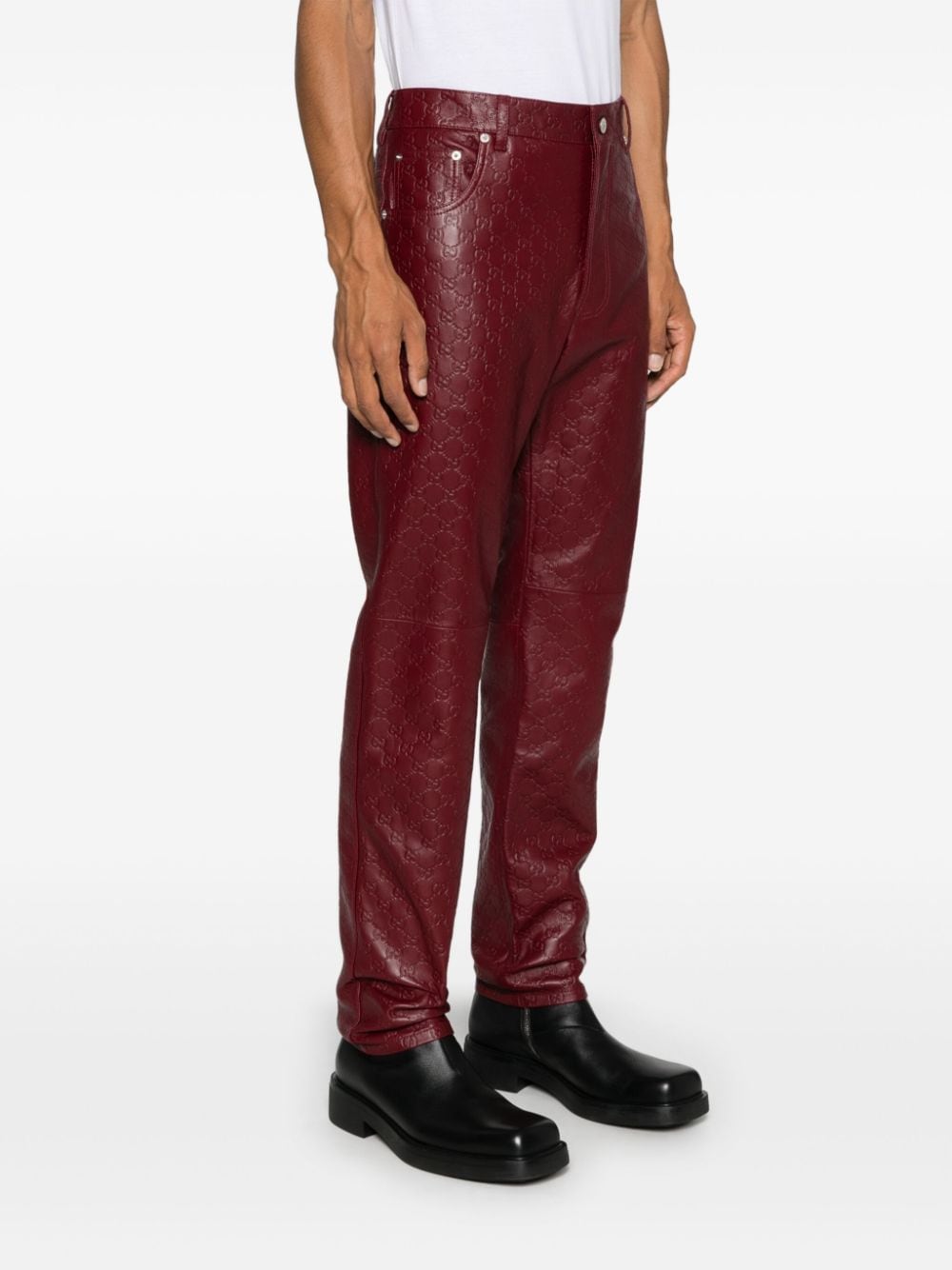 Shop Gucci Gg Supreme-debossed Trousers In 红色