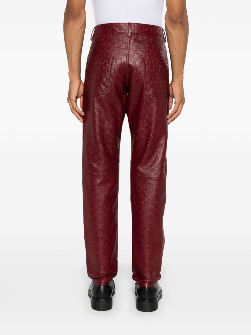 Shop Gucci Gg Supreme-debossed Trousers In 红色