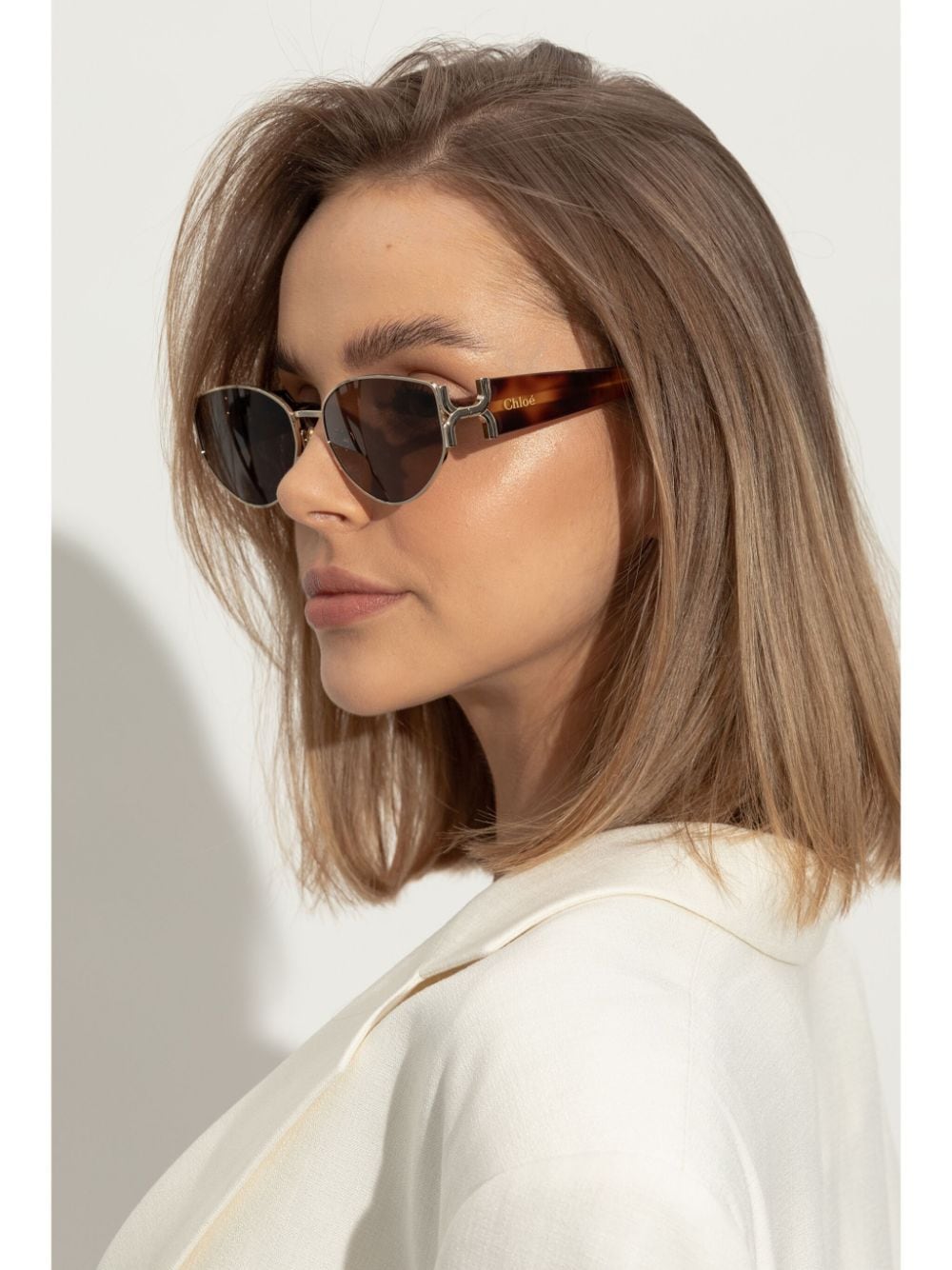 Chloé Eyewear Zonnebril met ovalen glazen en gegraveerd logo - Bruin