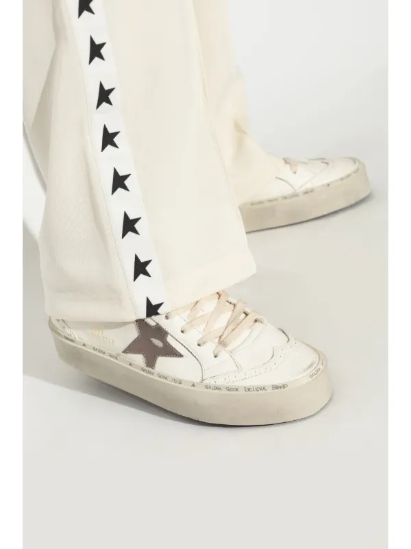 white trainers with gold stars