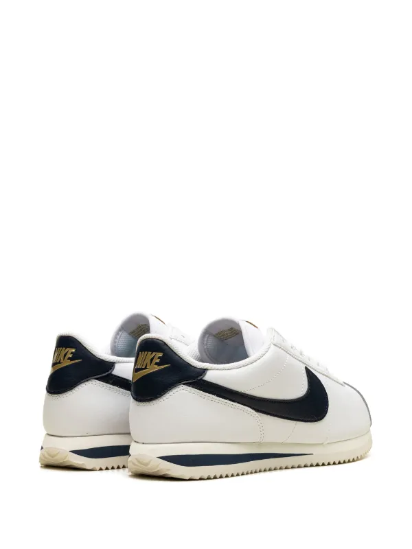 white and navy blue cortez