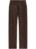 Moschino geometric-print trousers - Brown