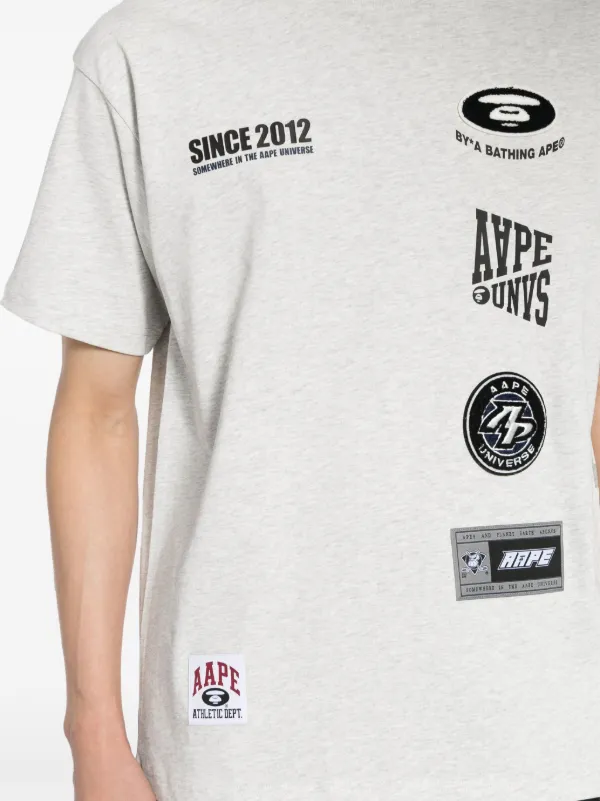 【AAPE by A BATHING APE】Moonface ロゴ グラフィック Tシャツ AAPE BY *A BATHING APE® Moonface Logo T-shirt | Black | FARFETCH