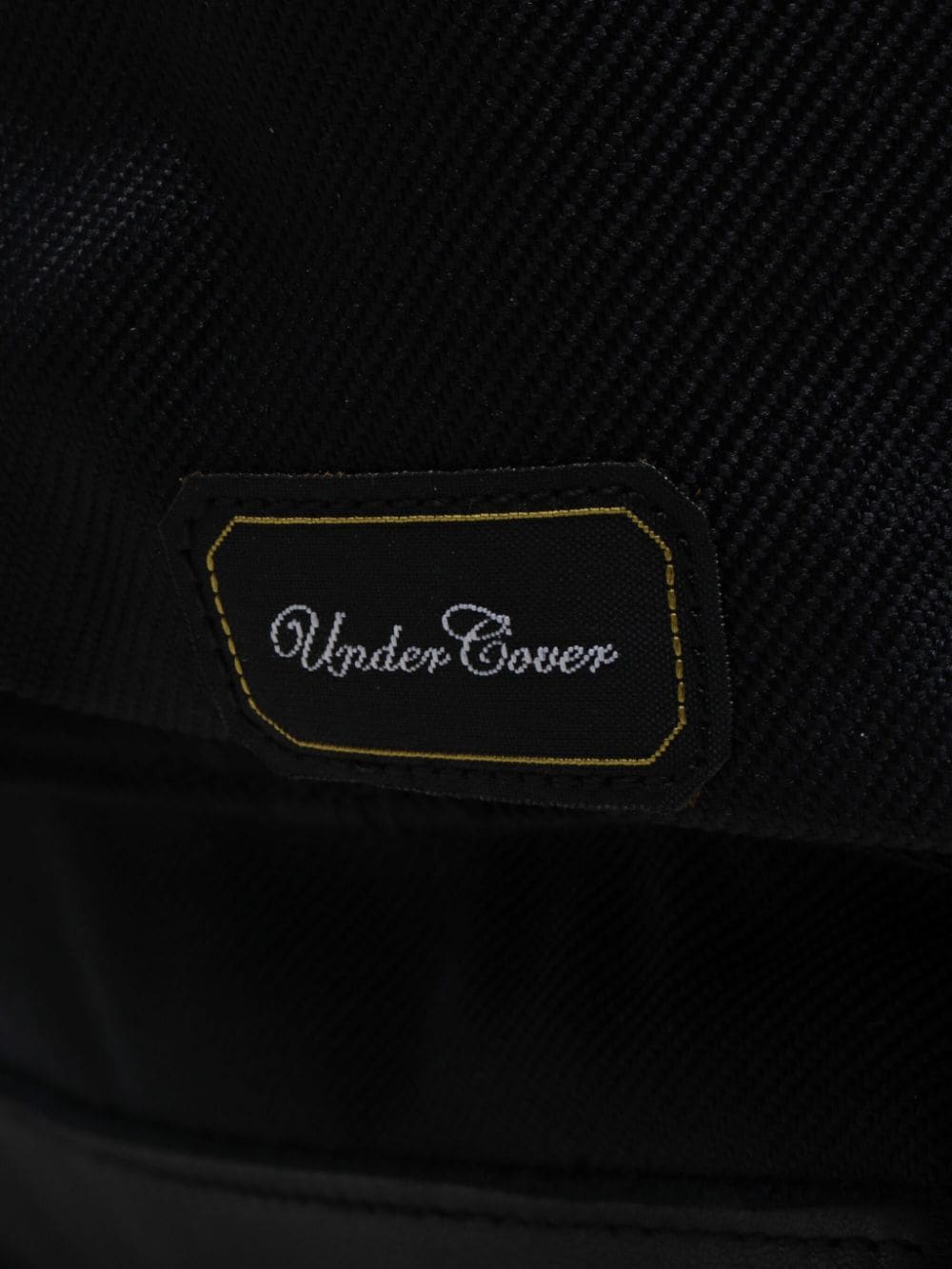 Shop Undercover Logo-appliqué Backpack In Black