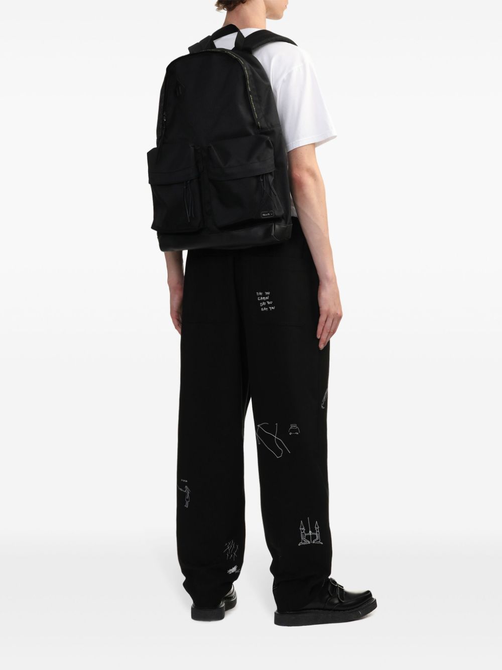 Shop Undercover Logo-appliqué Backpack In Black