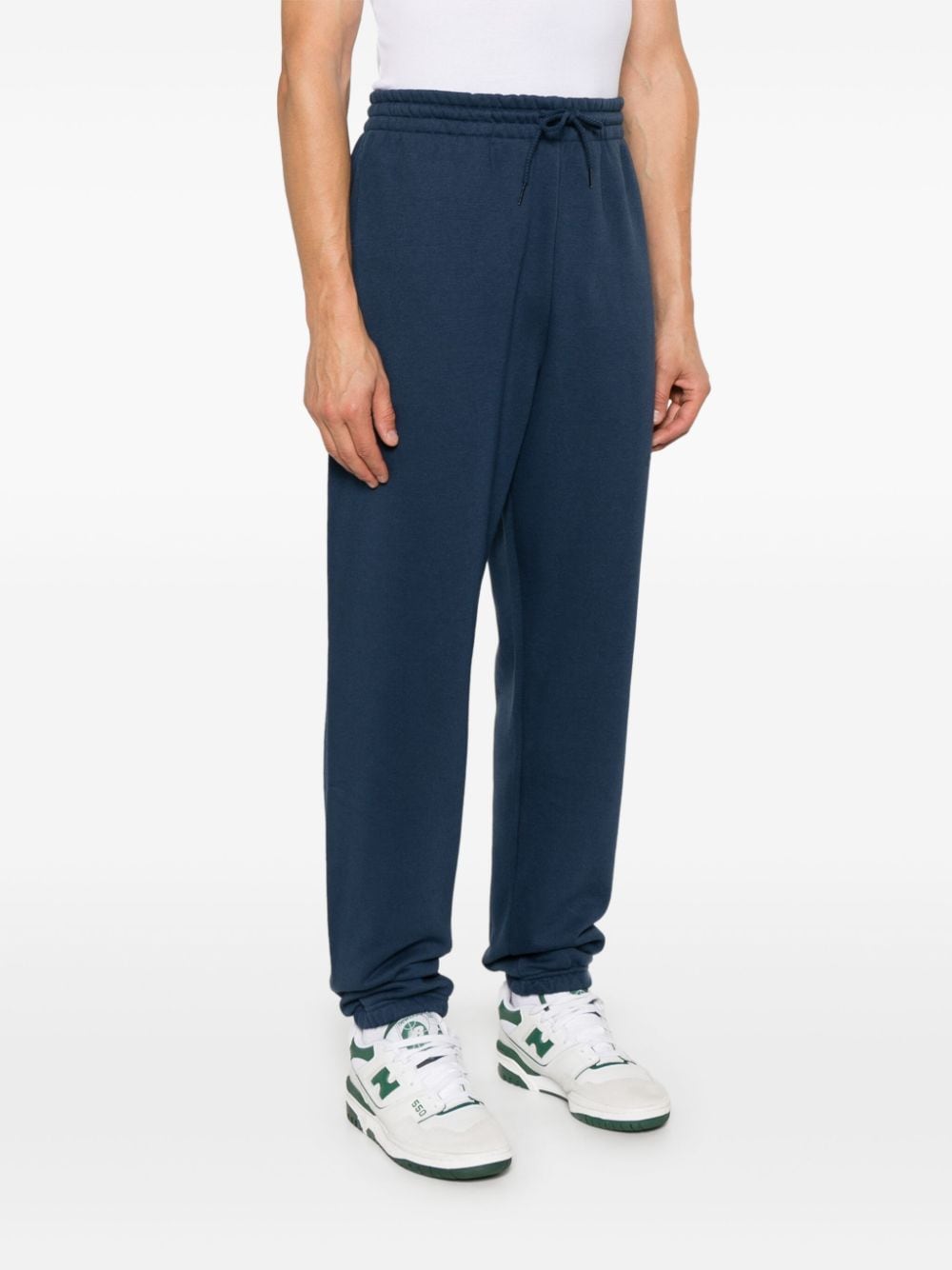 Shop New Balance Logo-embroidered Track Pants In Blue