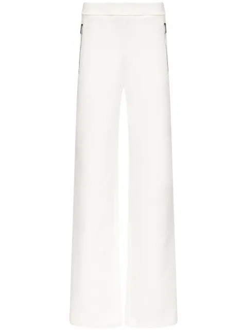 AREA embossed handprint track pants