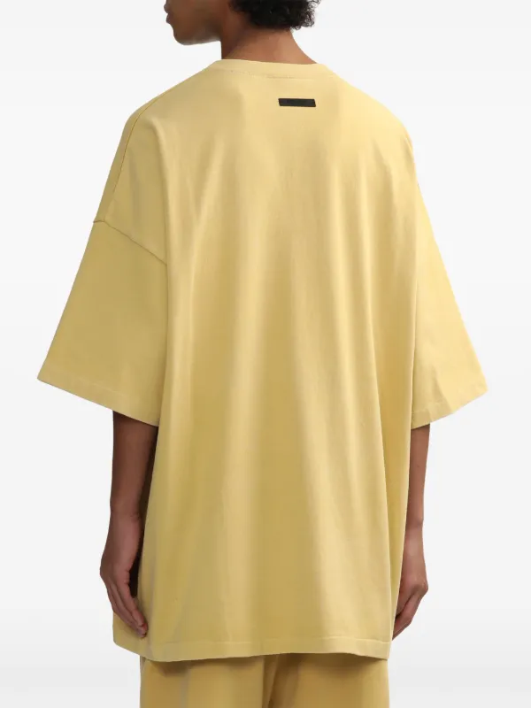 Fear of God ESSENTIALS Tシャツ・カットソー 黄 3369625M0006 FEAR OF GOD ESSENTIALS logo-print T-shirt | Yellow | FARFETCH JO