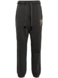 Musium Div. graphic-patch track pants - Grey