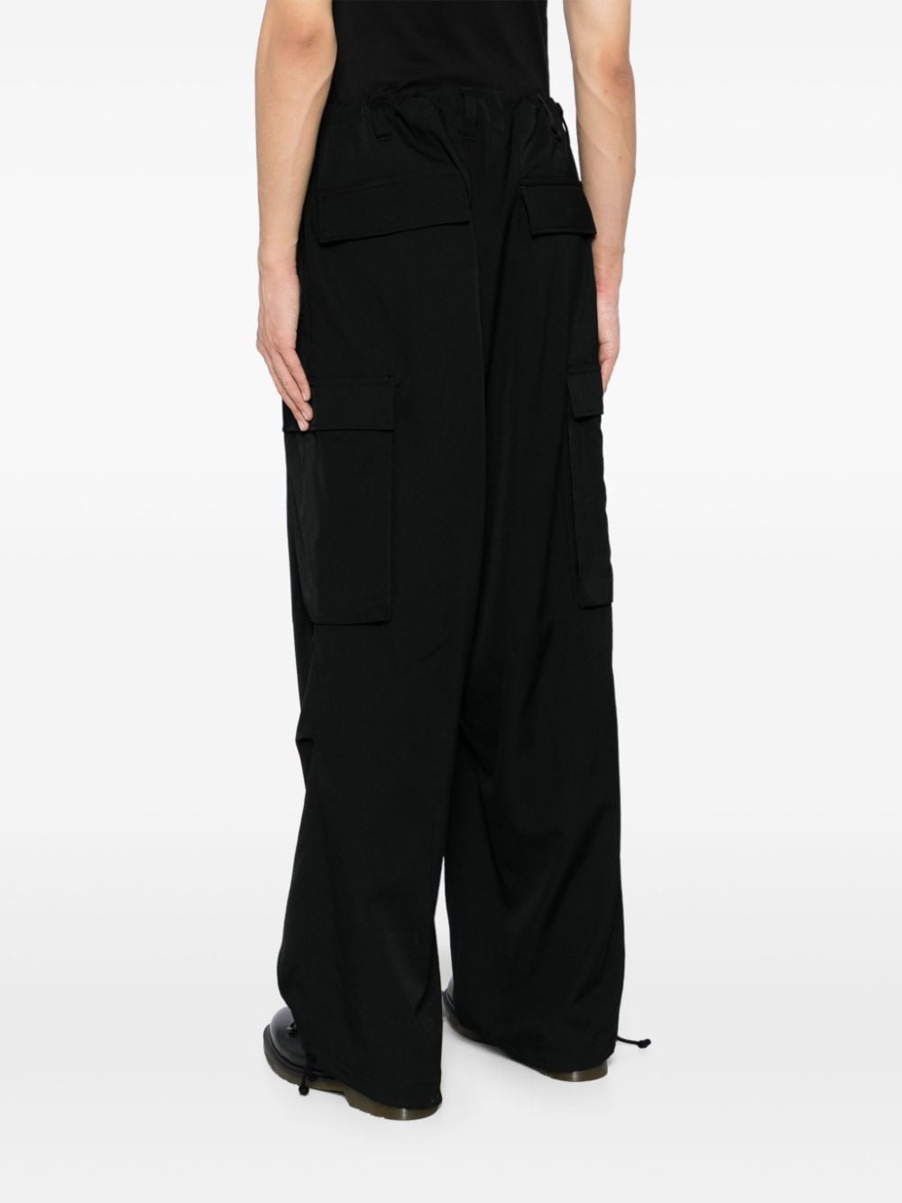 Shop Yohji Yamamoto Loose-fit Wool Trousers In Black